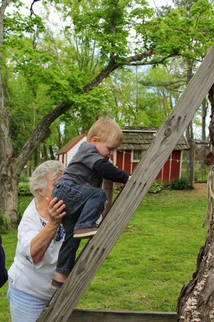 boy climbing ladder