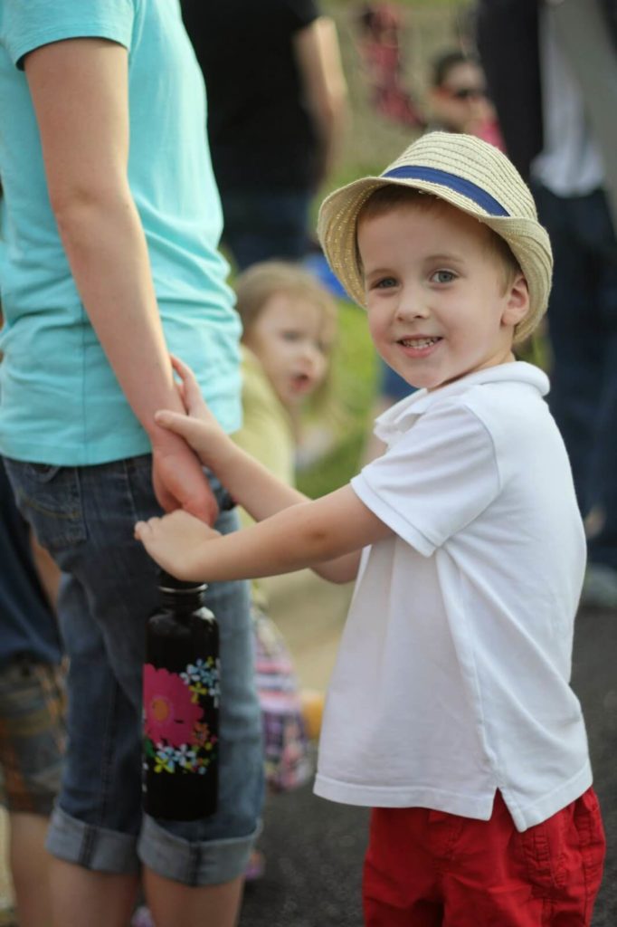 boy wearing hat smiling