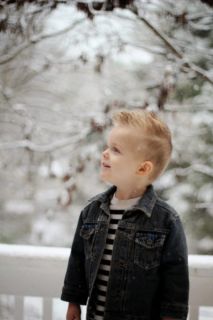 young boy with snowy background