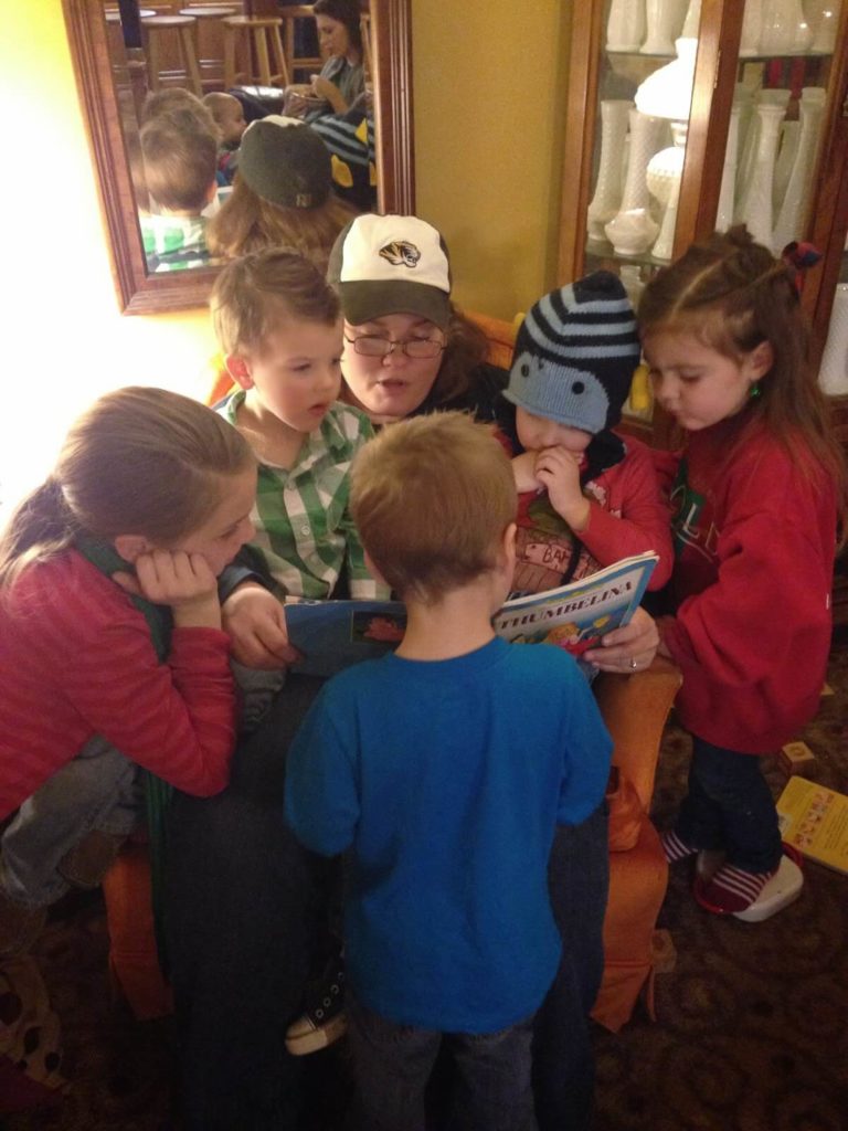 woman reading to kids