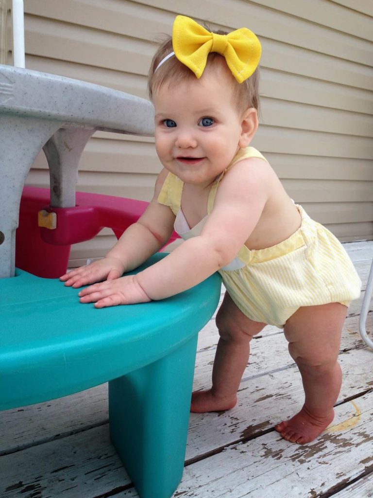 baby girl standing up