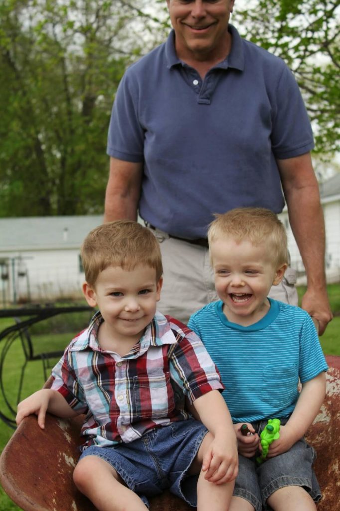 2 boys take wheelbarrow ride