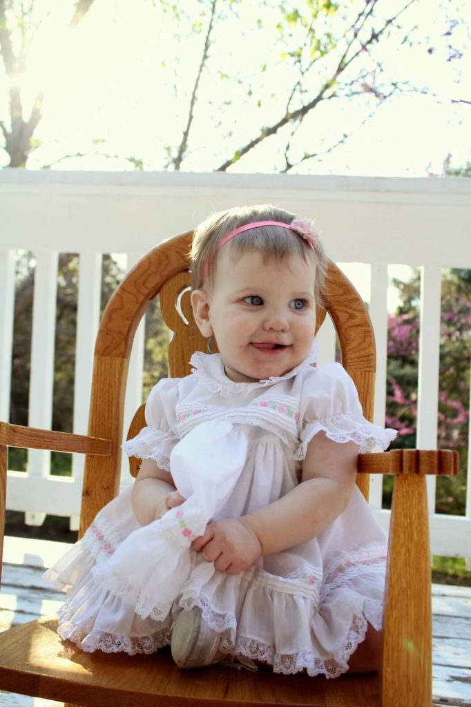 baby girl sitting in chair
