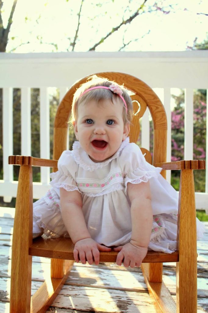 baby girl in white dress