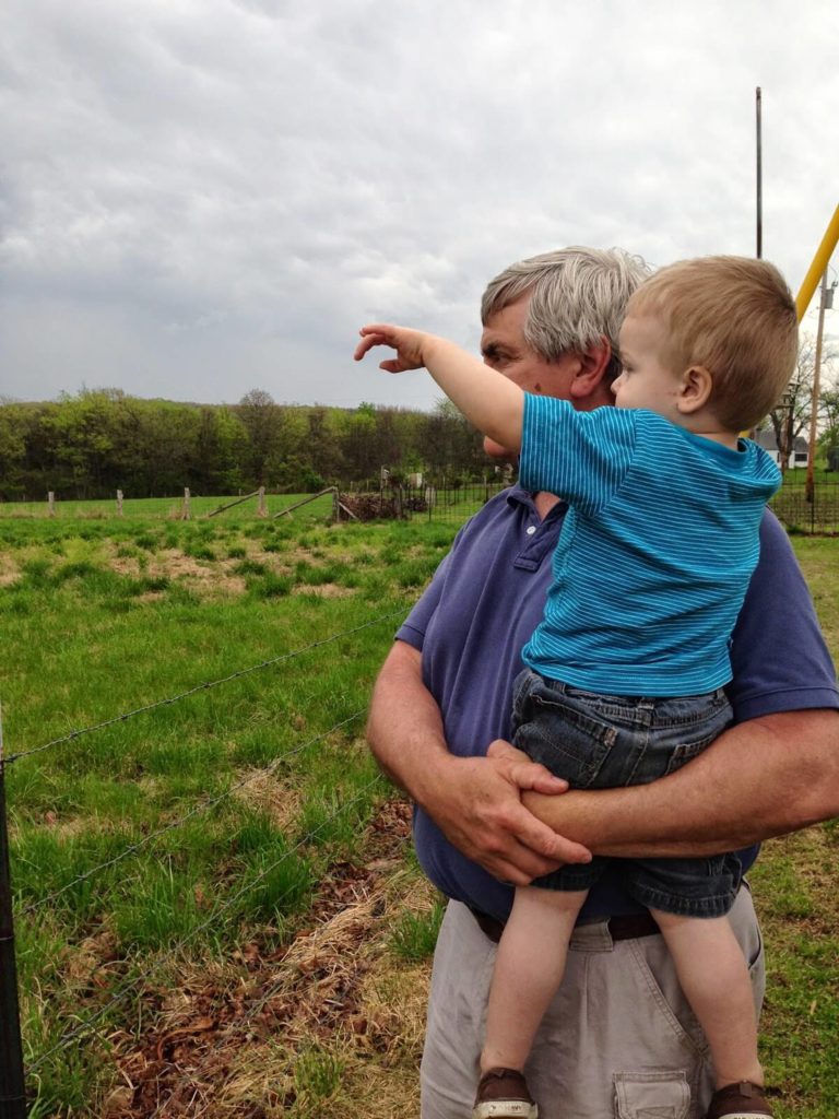 grandpa and toddler boy pointing