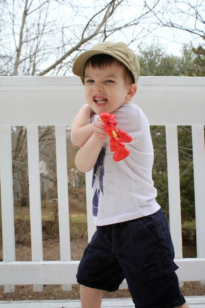 little boy playing with toys