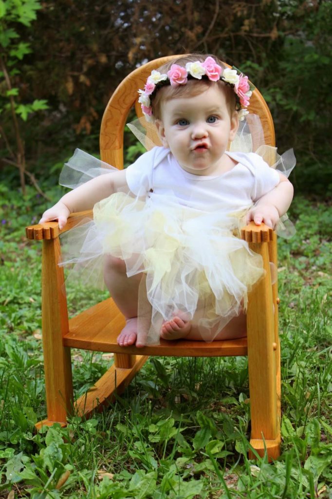 baby girl in white dress