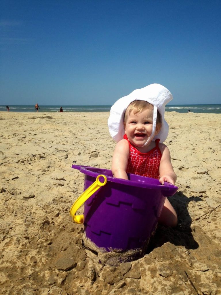 cute baby playing on beach