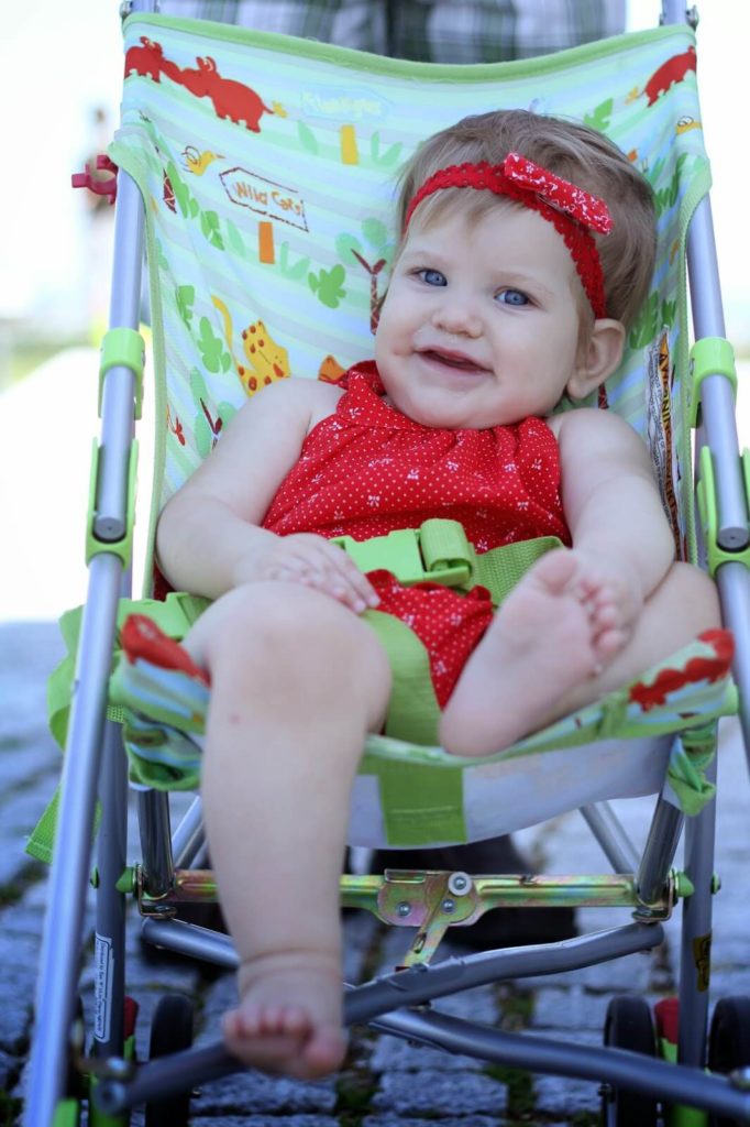cute baby girl in stroller