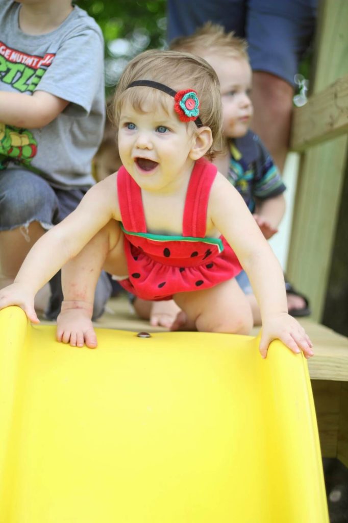 baby girl on slide