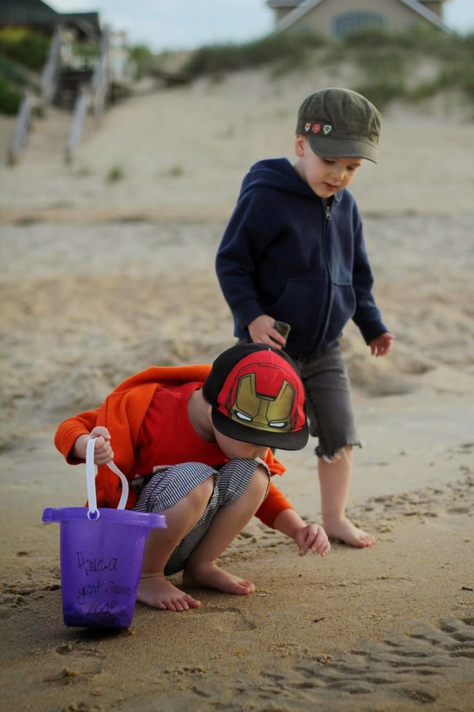 boys looking for seashells