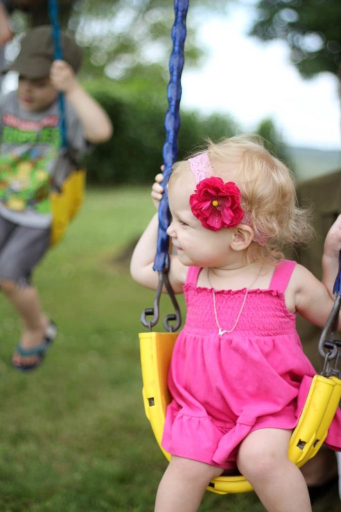 baby girl on swing