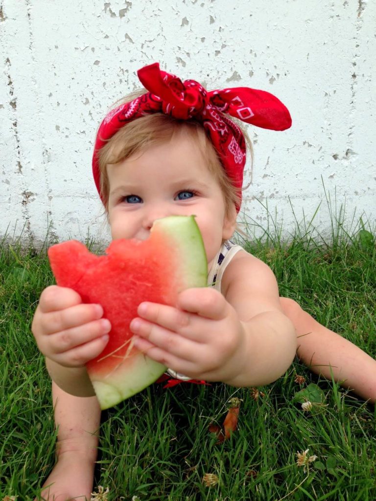 baby eating watermelon