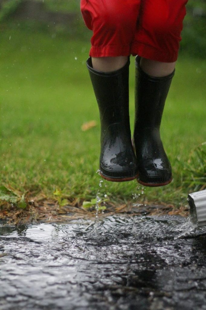 jumping in rain puddles