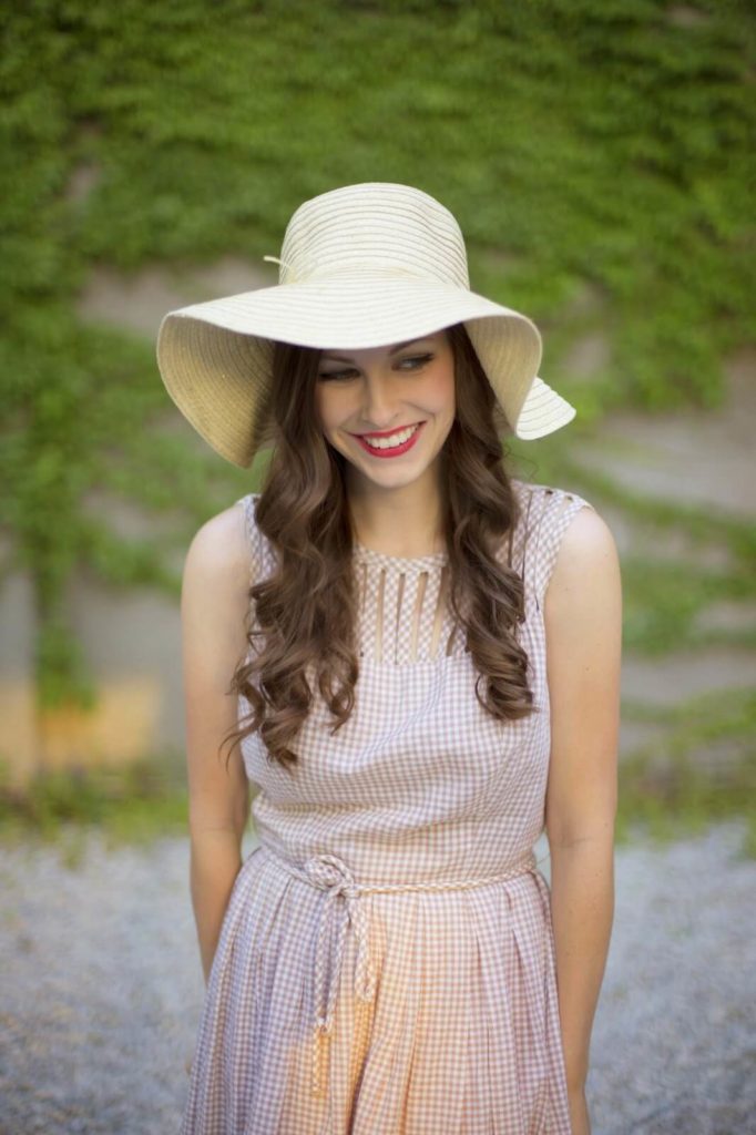 young woman wearing hat