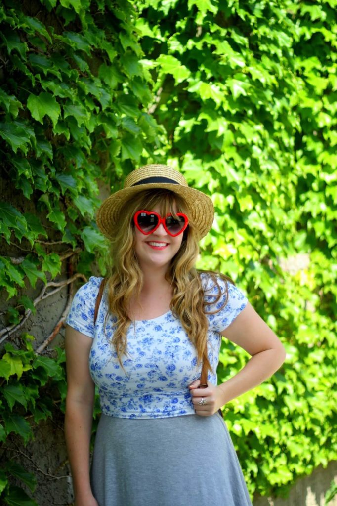 young woman with heart sunglasses