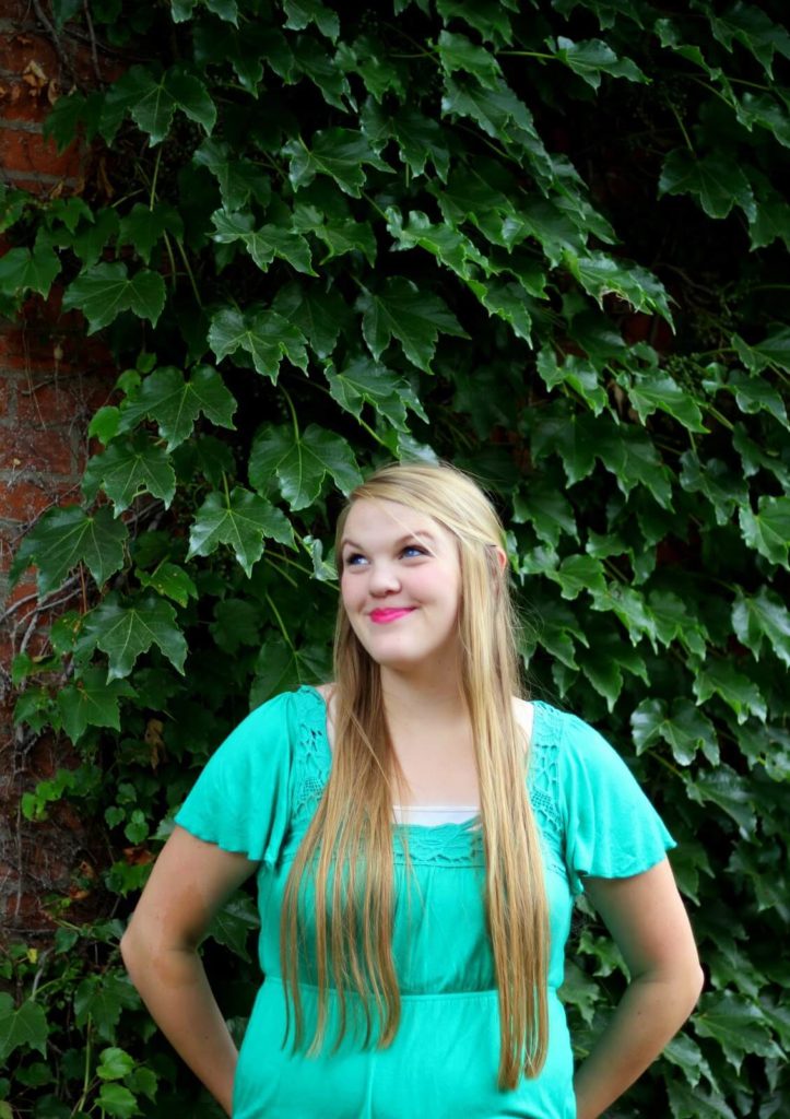 girl on ivy wall