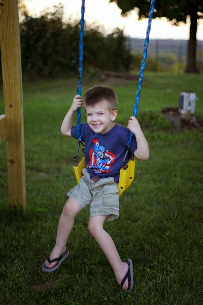 little boy on swing