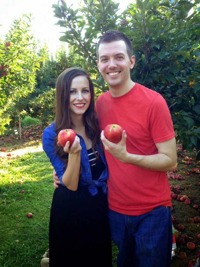 married couple going apple picking
