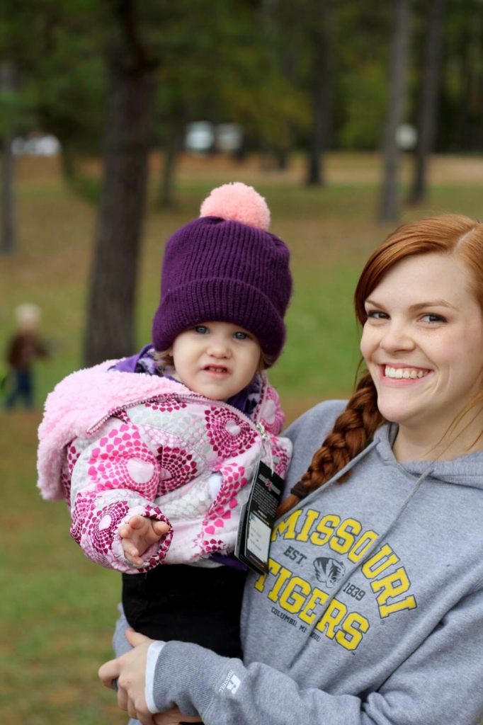 girl holding baby