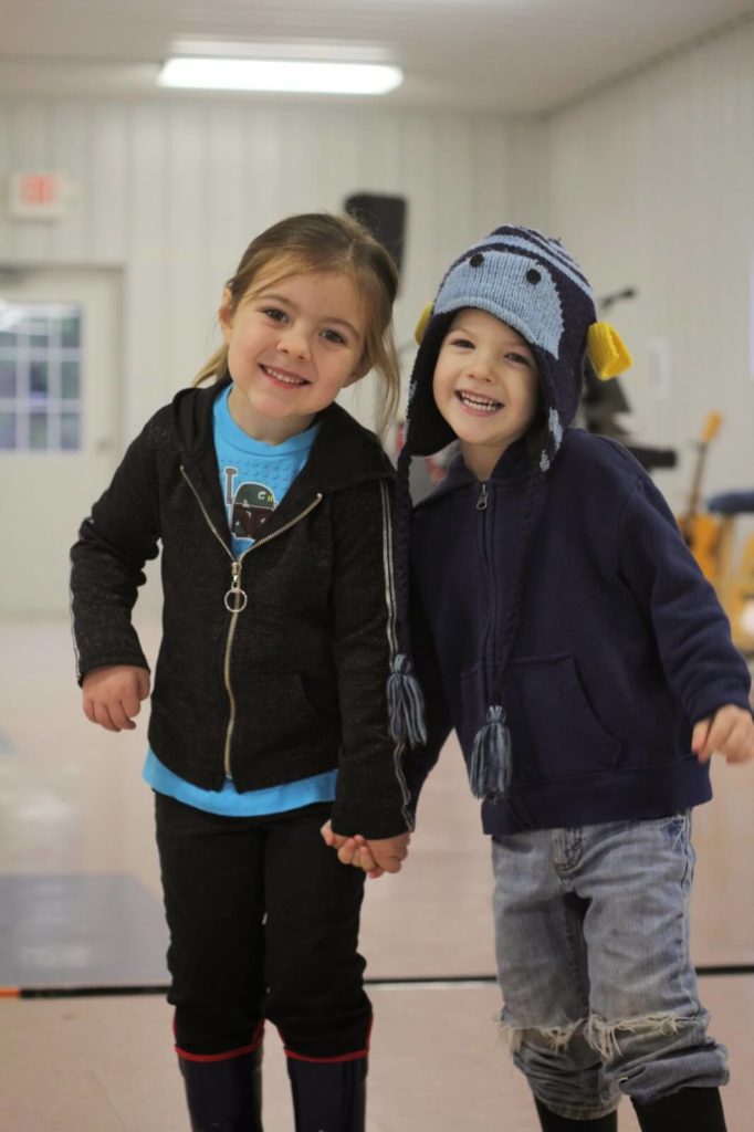 little boy and girl holding hands