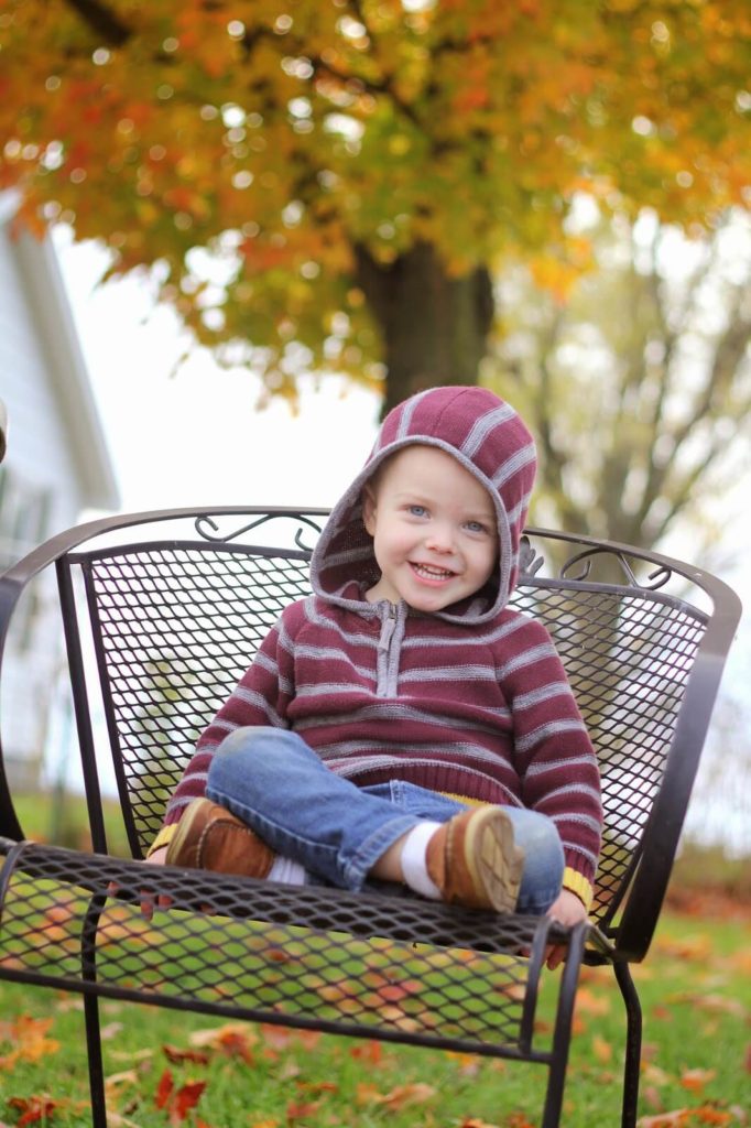 little boy on lawn chair
