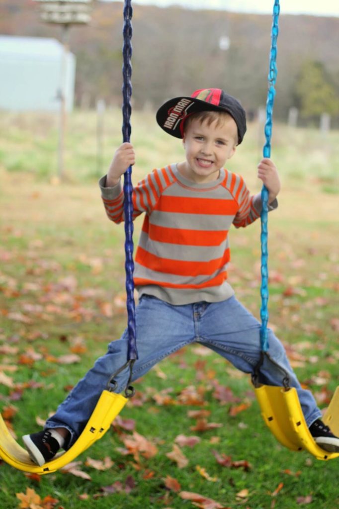 kid on swing