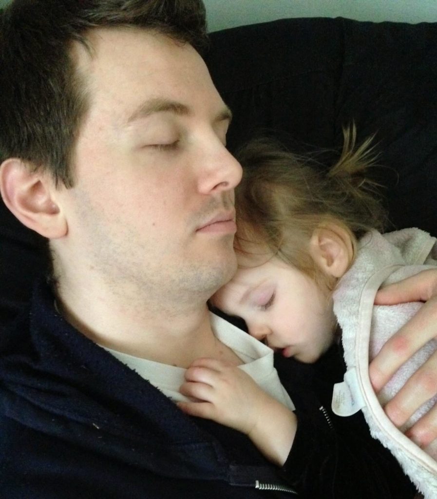 father and girl sleeping
