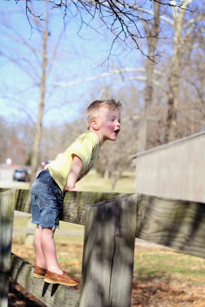 boy on fence