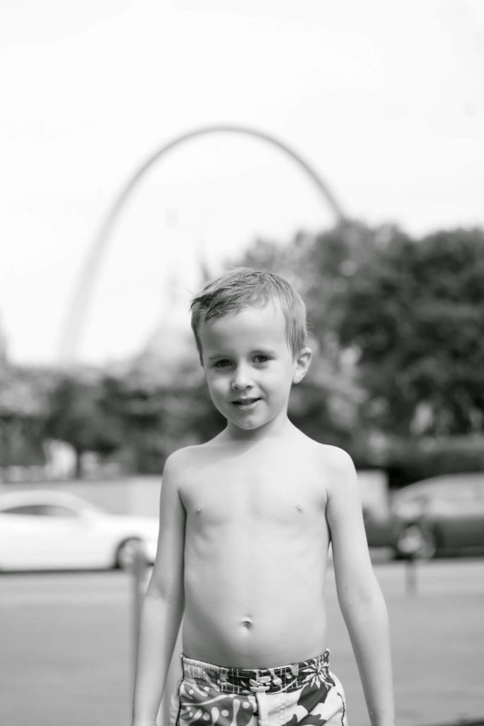 boy and st louis arch in background