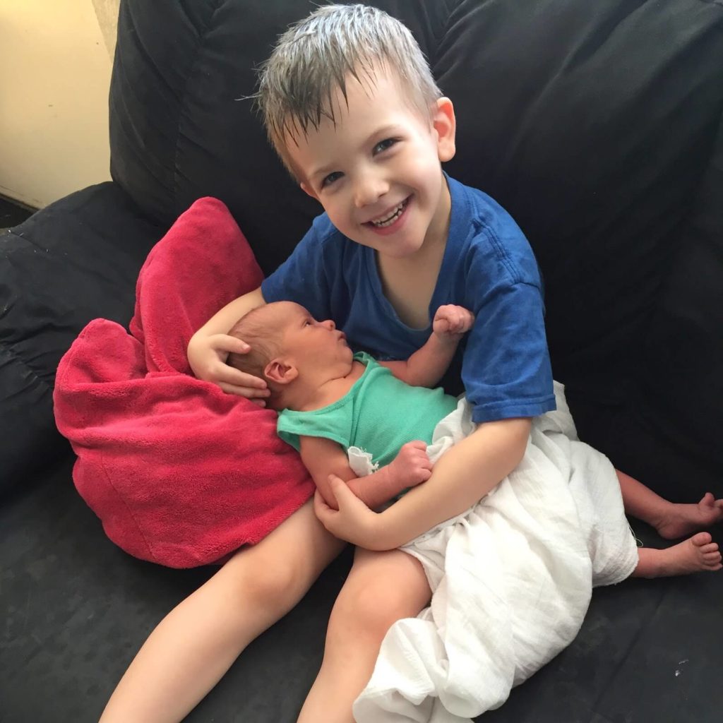 young boy with baby brother