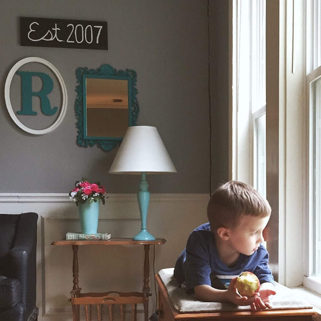 boy looking out window