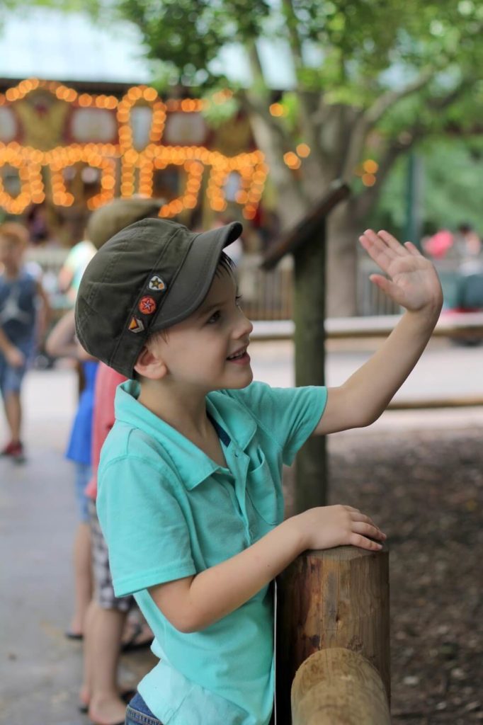 boy waving