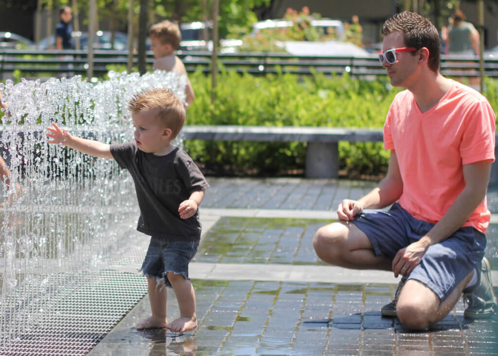 dad and boy playing at kiener plaza